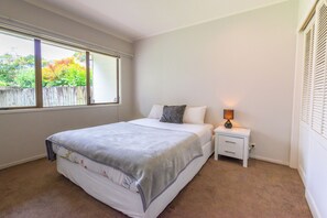 Bedroom 2, Queen bed, Wardrobe, Black-out blinds, Nightstand.