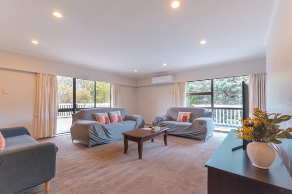 Spacious living room, TV, Sofa.