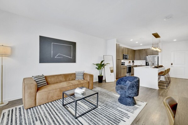 Sink into the plush, lush couch and unwind with your favorite shows or a captivating book.