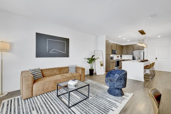 Sink into the plush, lush couch and unwind with your favorite shows or a captivating book.