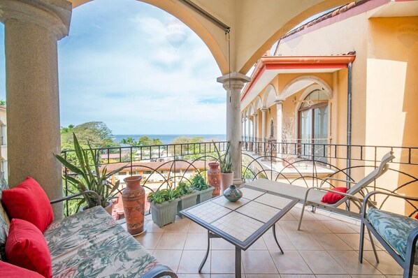 Pura Vida! Turn on vacation mode at full blast on our private terrace, featuring a serene ocean view.