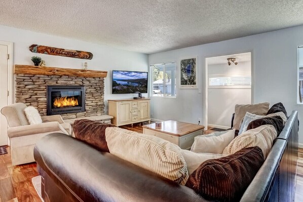 Comfy living room with warm gas fireplace & Smart TV