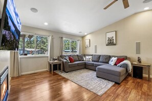 Living room smart TV with gas fireplace.