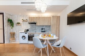 Kitchen and dining area in your ground-floor apartment at Mandara Beach by eDwelling, Juan-les-Pins – Perfect for your stay on the French Riviera.