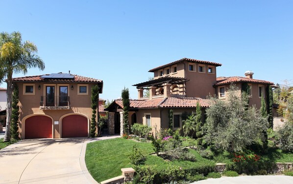 Apartment located above the detached garage on the left