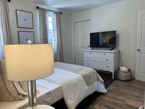 Our cozy 2nd bedroom on the 2nd floor has a Queen bed, TV,  closet and dresser
