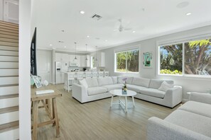 Living Room | Open concept, white and bright coastal design with ample seating.