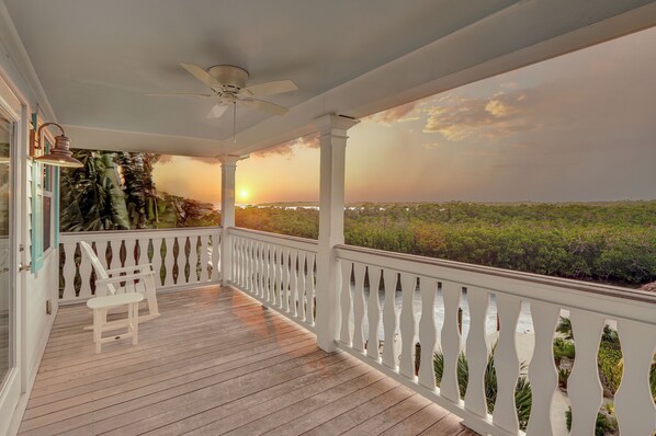 Balcony | Watch amazing sunrises and sunsets from your private, 2nd floor balcony with a direct water view.