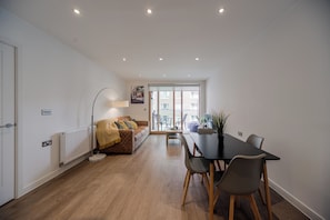 Bright Living room, with access to the balcony. Generous sized room large enough to fit the blow up double bed.