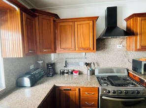 The kitchen is fully equipped with all the appliances you need.  