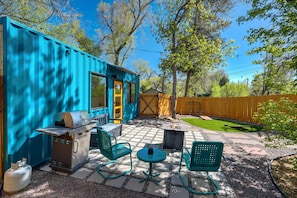 Perfect fStep outside to your private patio, complete with a BBQ grill and cozy seating – perfect for relaxing evenings by the fire pit under the string lights.or morning coffee or evening cocktails, this modern patio offers a seamless blend of comfort and sophistication, inviting you to unwind and savor every moment.