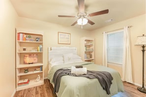 The second guest bedroom is outfitted with a queen sized bed and luxury linens for a good's night rest.