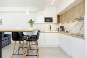 Kitchenette with a kettle.