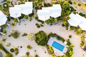 Aerial of the pool and surrounding homes. 