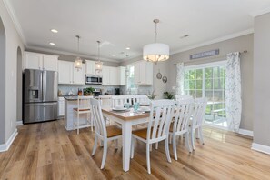 [Dining Room and Kitchen] Farmhouse table for 8 off fully equipped kitchen.