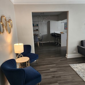 View from entrance through living room to kitchen