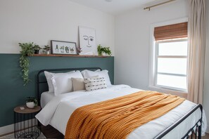Wake up refreshed in this bright, cozy bedroom designed for dreamy mornings.