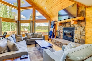 With two additional sofas and serene views, this space is perfect for relaxing and enjoying the peaceful surroundings.