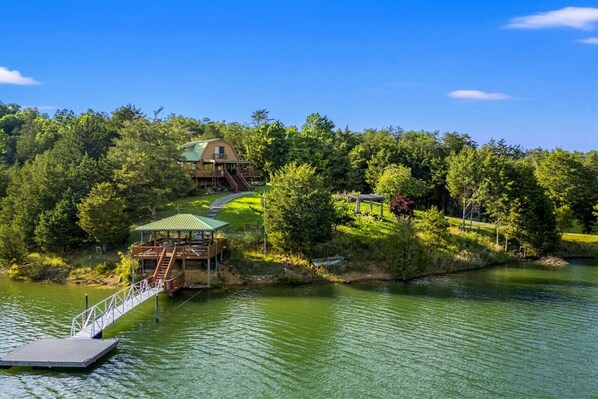 Your private boat dock beckons for lazy afternoons of fishing or simply basking in the sun.