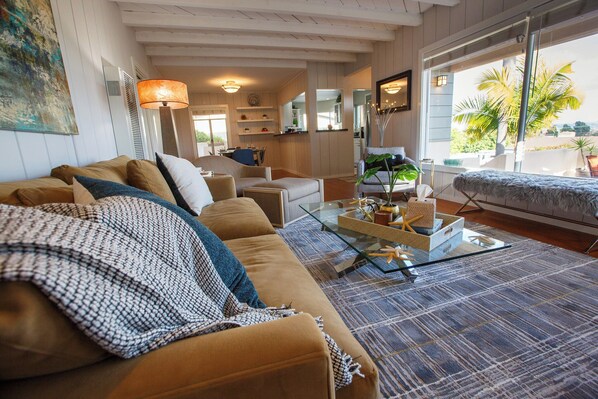 Living room with a view, upscale, cozy, and comfortable.
