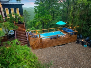 This 8x20 Container Pool has a surrounding deck, shallow sun shelf, and fun swim area with more amazing views of the Kiamichi Mountains.