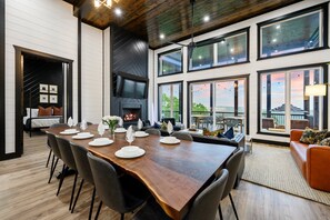 The main floor living + dining + kitchen sets the perfect gathering. Enjoy the custom live edge dining table!