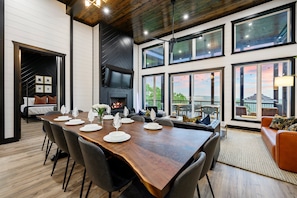 The main floor living + dining + kitchen sets the perfect gathering. Enjoy the custom live edge dining table!