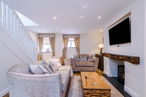 The crisp sitting room with muted colouring