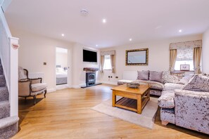 The sitting room provides a relaxing ambiance in comfortable surroundings