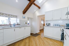 Natural light fills the well-equipped kitchen