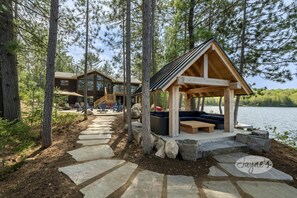 Walkway to Waterfront &amp; Pergola with Lounge Seating