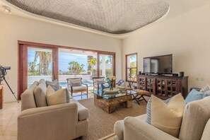 Living Room with Marble Flooring, Domed Ceilings. Looks out to pool and ocean.