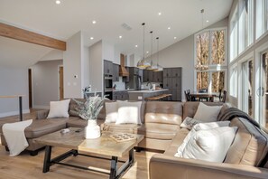 Huge open-concept living room, kitchen & dining space to gather w/ loved ones