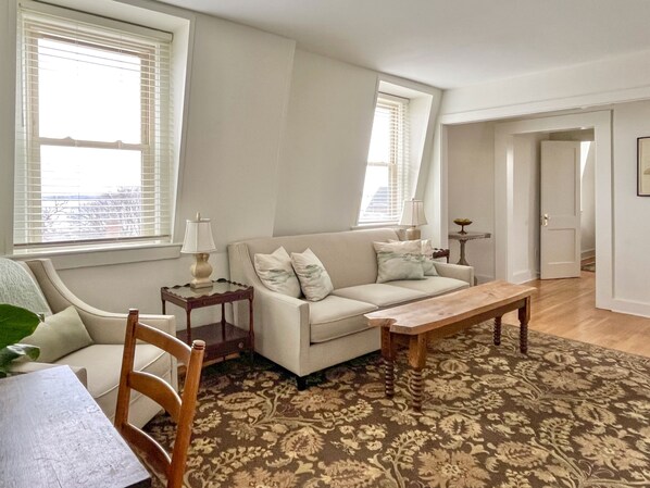 Light-filled living room with views of S. Main St. and Seneca Lake