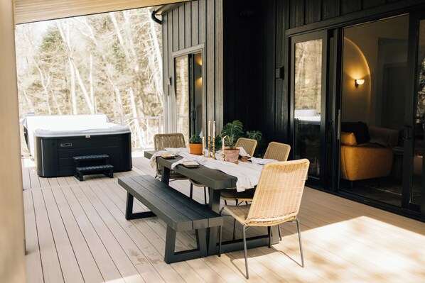 The outdoor dining table awaits for delightful meals and enjoyable gathering. 