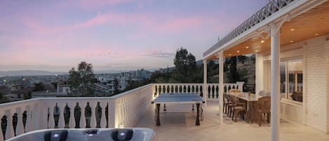 Outdoor Area with View and Private jacuzzi and Dining Table