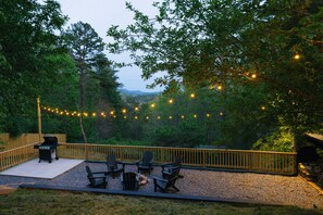 Fire pit with long range mountain views, propane grill and fire wood storage