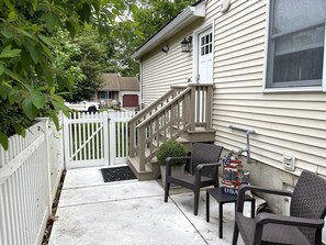 Private entrance with patio area
