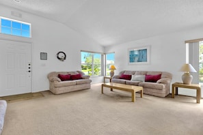 A more formal large living area for family gatherings with plenty of seating