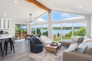 Open-plan living area with floor-to-ceiling window
