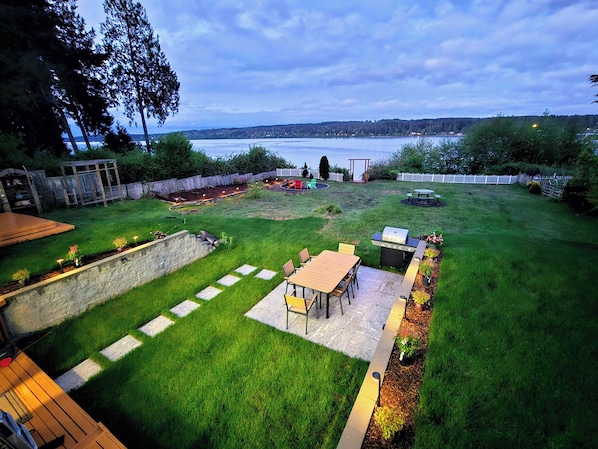 Scenic aerial view of our lush waterfront property, showcasing direct beach A