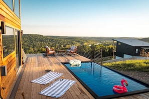 Outdoor Oasis: Dive into stunning views from the poolside, your perfect relaxation spot awaits!
