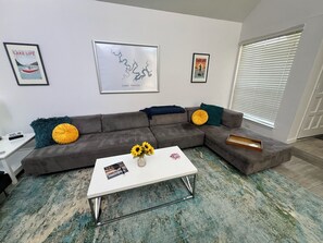 Take the backings off of the modular couch to create 2 twin beds.