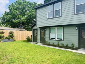 The yard is well maintained and features plants that are maintained by the owner.