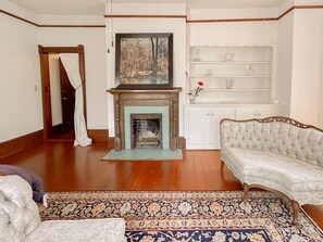 The quaint fireplace is one of the highlights of the room.