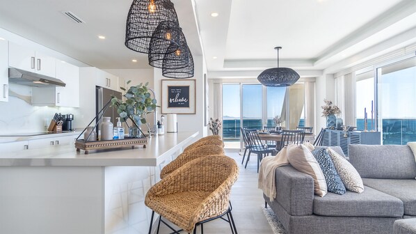 the bar stools at the kitchen counter make a great spot for a casual breakfast