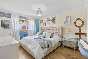 Indulge in the glamorous, large master suite featuring a large walk-in closet, a vanity area, and a beautiful en suite bathroom with marble floors and granite finishes. With its luxury amenities and large windows, this private retreat is your perfect