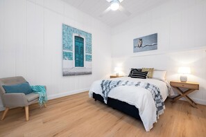 Bedroom 2 features a queen bed with a plush Sealy mattress.