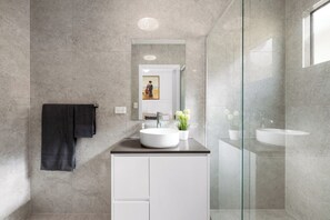 Full ensuite bathroom 1 boasts a contemporary-style finish.