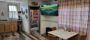 Large TV and Cozy Dining Table
